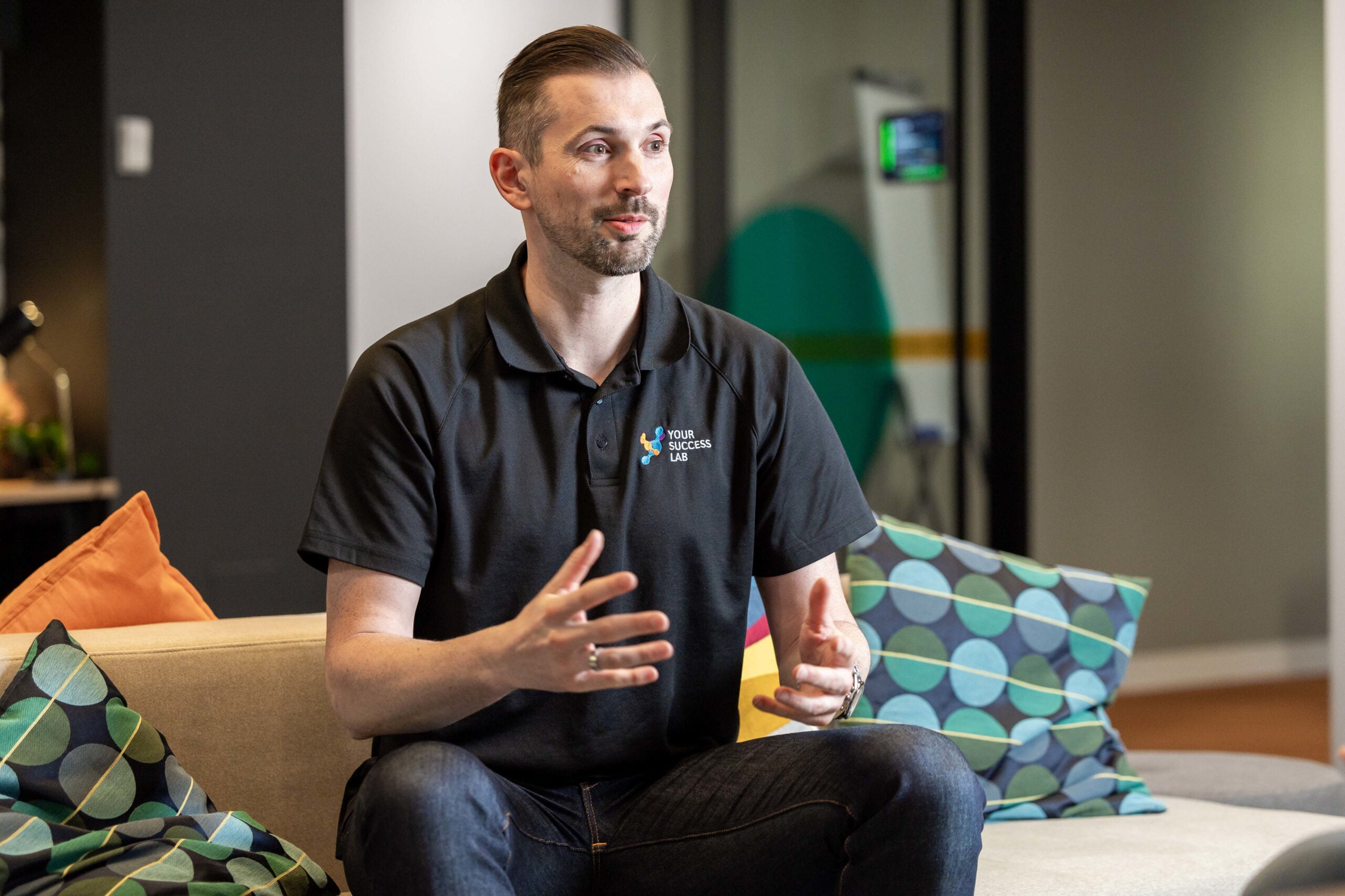Business Coach Daniel Lalic speaking in a meeting in the 33 King William Street Your Success Lab office.